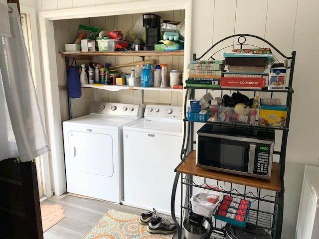 1844 Holloway Cir, Lebanon, TN 37090 - washroom with light wood-style flooring, washer and clothes dryer, and laundry area