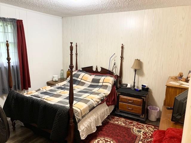 1844 Holloway Cir, Lebanon, TN 37090 - bedroom with dark wood-style floors and a textured ceiling