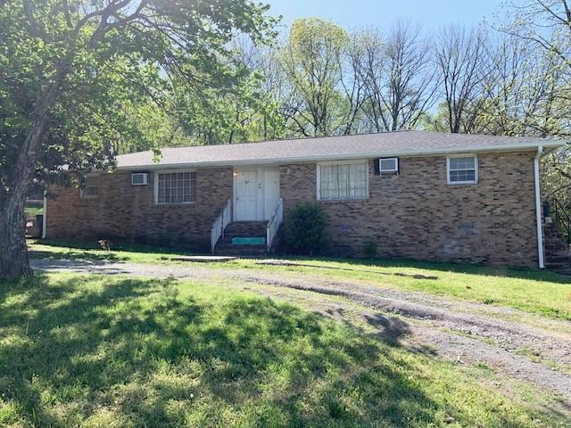 1844 Holloway Cir, Lebanon, TN 37090 - ranch-style house featuring a front yard and brick siding