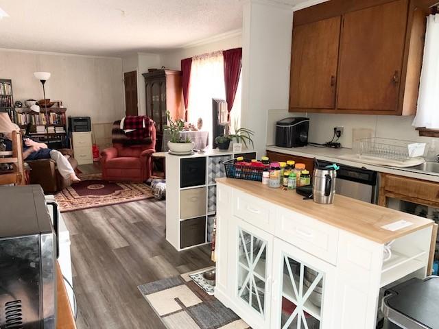 1844 Holloway Cir, Lebanon, TN 37090 - kitchen featuring open floor plan, dark wood-type flooring, brown cabinetry, and wood counters
