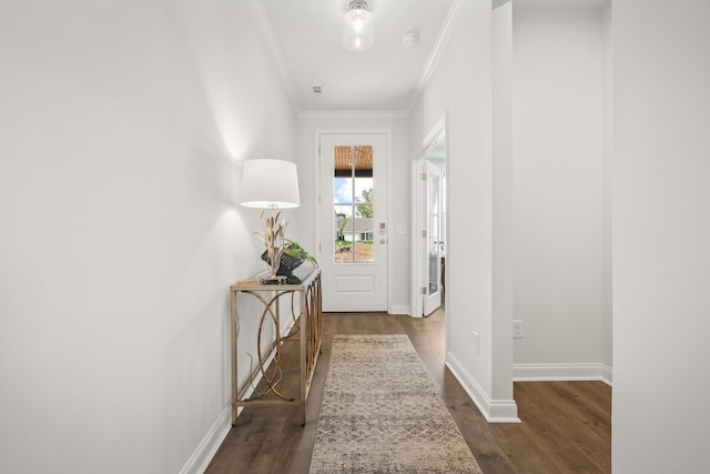 corridor featuring crown molding, baseboards, and dark wood-style flooring