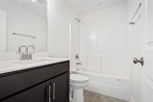bathroom with tile patterned flooring, toilet, vanity, and shower / bathing tub combination