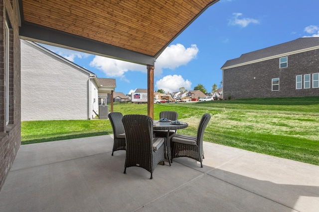 view of patio / terrace featuring cooling unit, a residential view, and outdoor dining area