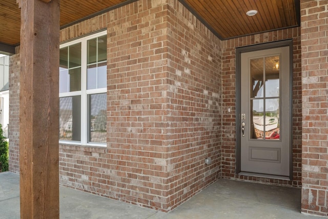 entrance to property with brick siding