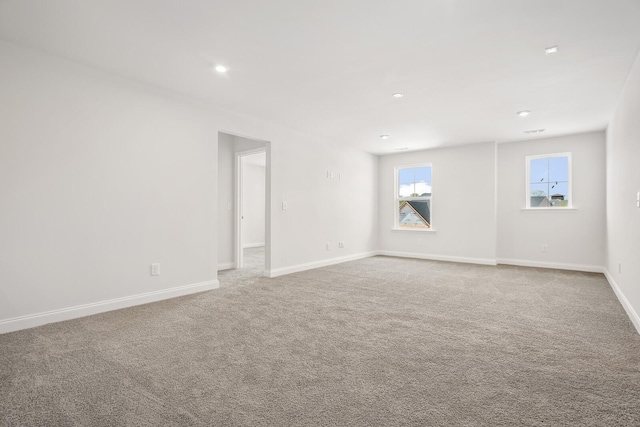 empty room with recessed lighting, carpet floors, and baseboards