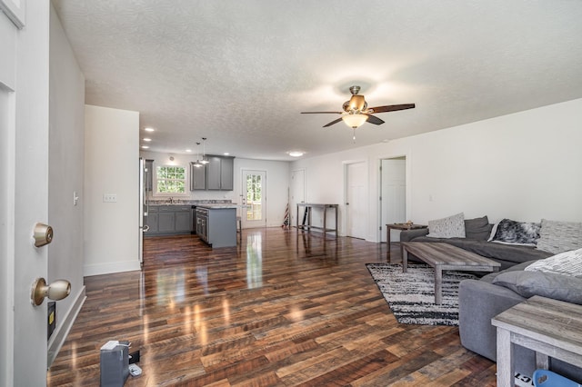 166 Mount Vernon Church Rd, Bethpage, TN 37022 - living area featuring baseboards, a ceiling fan, dark wood-style floors, and a textured ceiling