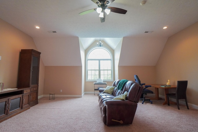 living area with light colored carpet, ceiling fan, baseboards, visible vents, and lofted ceiling