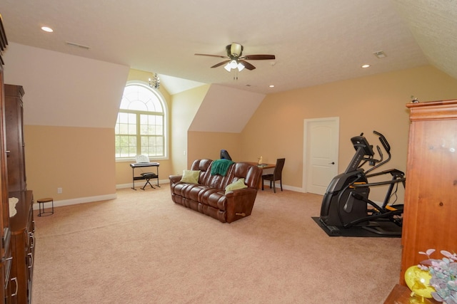 interior space with light carpet, ceiling fan, baseboards, visible vents, and lofted ceiling