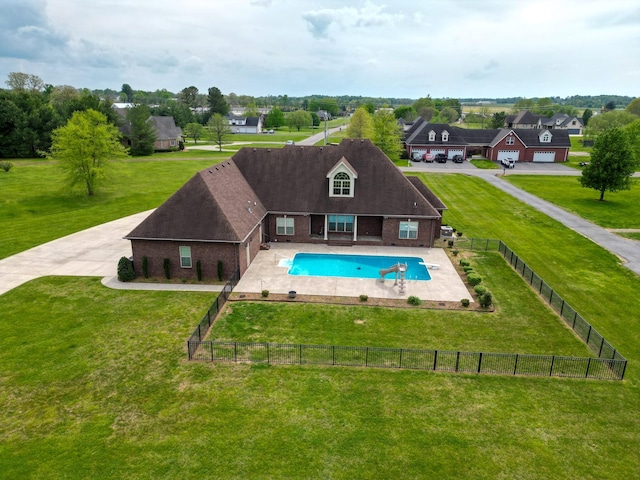 view of pool with a fenced in pool, a lawn, a residential view, and a fenced backyard