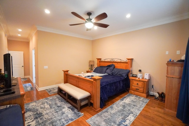 bedroom featuring crown molding, recessed lighting, wood finished floors, and baseboards