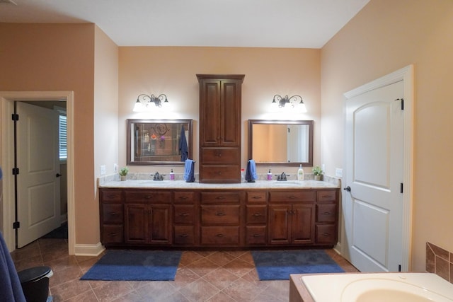 full bath with tile patterned flooring, double vanity, and a sink