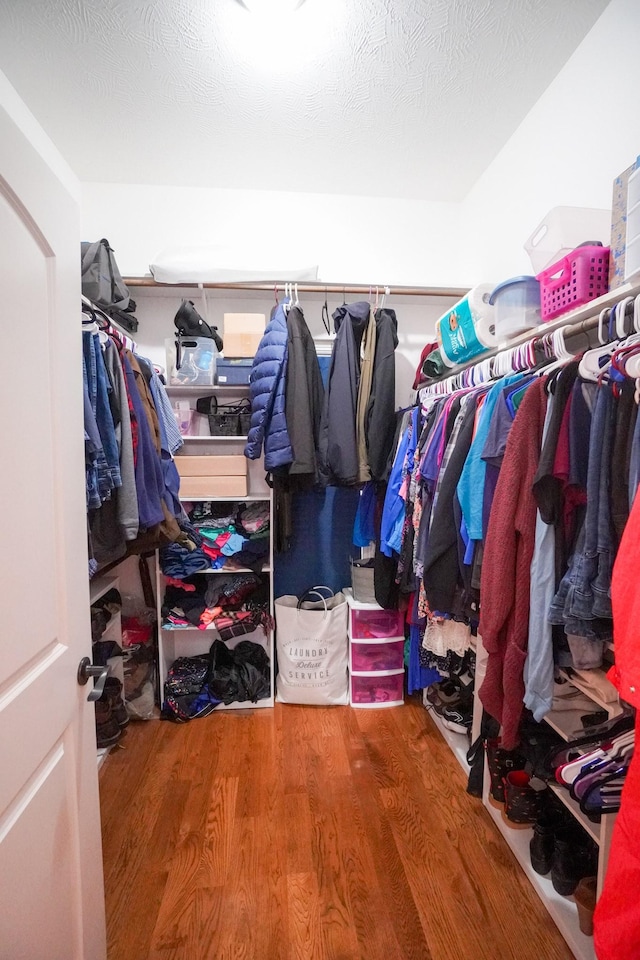 spacious closet featuring wood finished floors