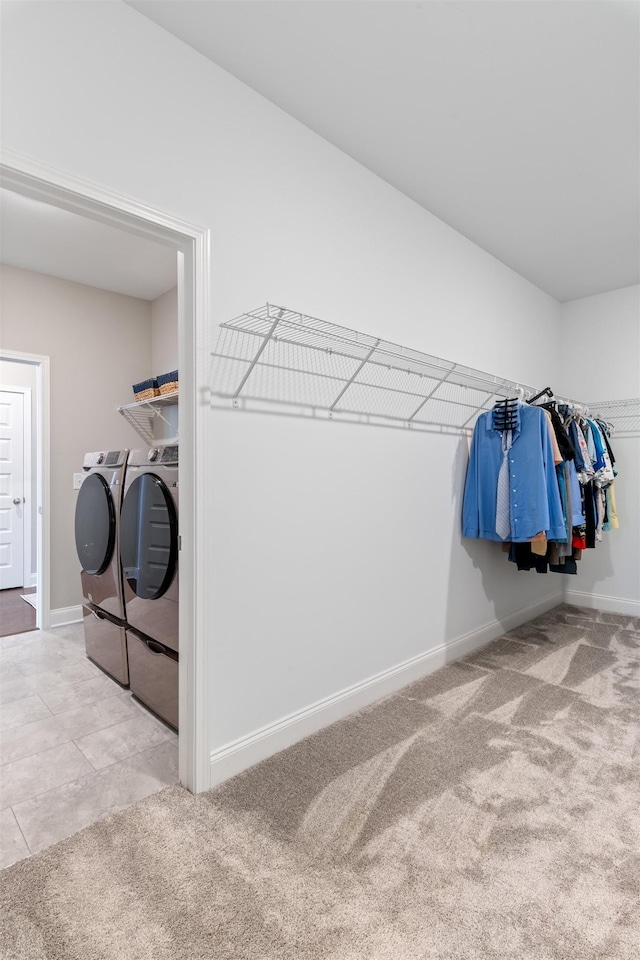 565 Kipton Trl, Lebanon, TN 37087 - laundry area with washing machine and clothes dryer, carpet floors, laundry area, and baseboards