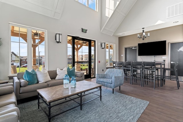 565 Kipton Trl, Lebanon, TN 37087 - living area featuring wood finished floors, visible vents, high vaulted ceiling, and a healthy amount of sunlight