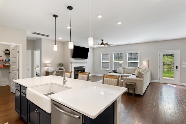 565 Kipton Trl, Lebanon, TN 37087 - kitchen featuring visible vents, dishwasher, open floor plan, a ceiling fan, and a fireplace