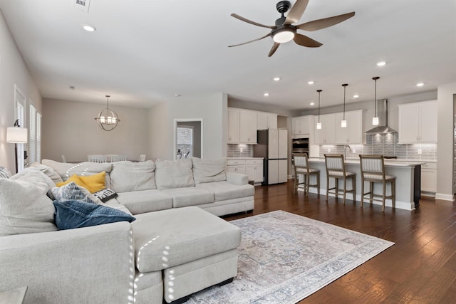 565 Kipton Trl, Lebanon, TN 37087 - living area featuring ceiling fan with notable chandelier, dark wood-style floors, and recessed lighting