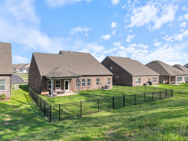 565 Kipton Trl, Lebanon, TN 37087 - rear view of property with a patio, brick siding, a fenced backyard, and a lawn