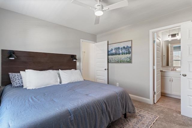 565 Kipton Trl, Lebanon, TN 37087 - bedroom with baseboards, a sink, a ceiling fan, ensuite bath, and light carpet