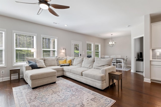 565 Kipton Trl, Lebanon, TN 37087 - living area featuring visible vents, baseboards, dark wood-style flooring, and ceiling fan with notable chandelier