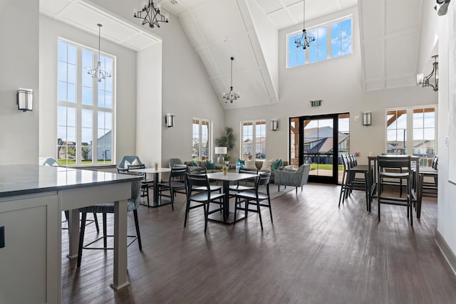 565 Kipton Trl, Lebanon, TN 37087 - dining room featuring high vaulted ceiling, an inviting chandelier, dark wood-type flooring, and a wealth of natural light