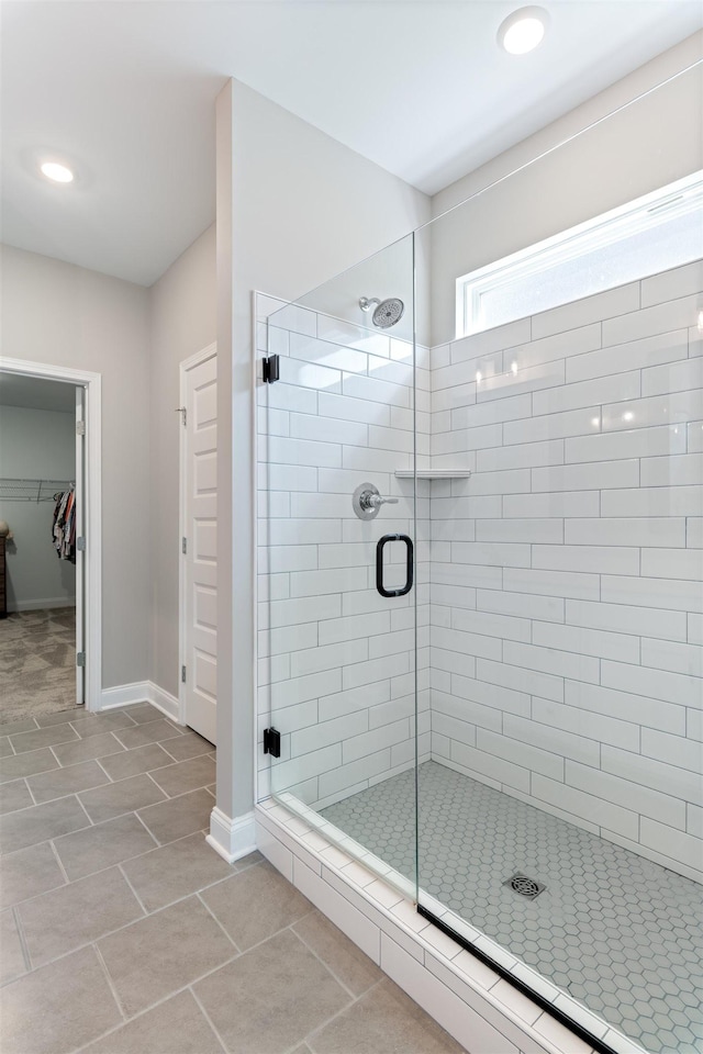 565 Kipton Trl, Lebanon, TN 37087 - bathroom featuring tile patterned floors, a stall shower, baseboards, recessed lighting, and a walk in closet