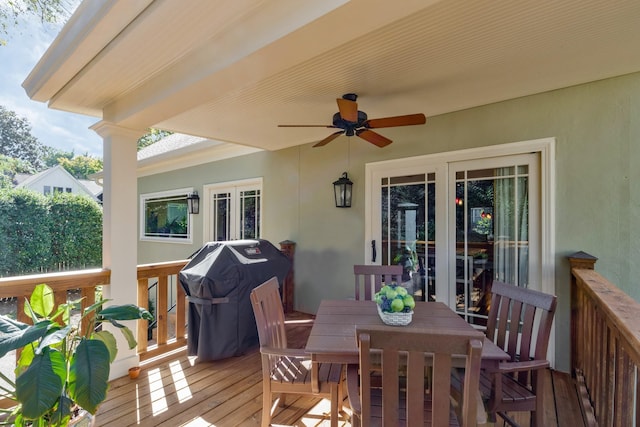 deck featuring ceiling fan, outdoor dining space, and area for grilling
