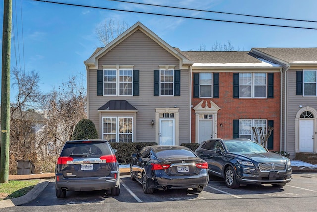 townhome / multi-family property with uncovered parking