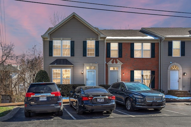 view of front of house with uncovered parking