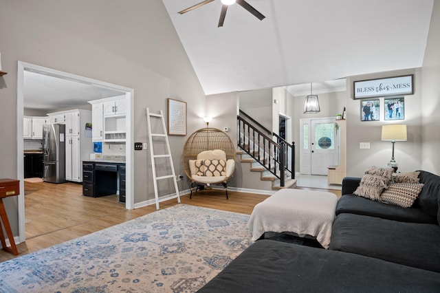 2321 Chimney Hills Dr, Soddy Daisy, TN 37379 - living area with ceiling fan, stairs, light wood-style flooring, baseboards, and lofted ceiling