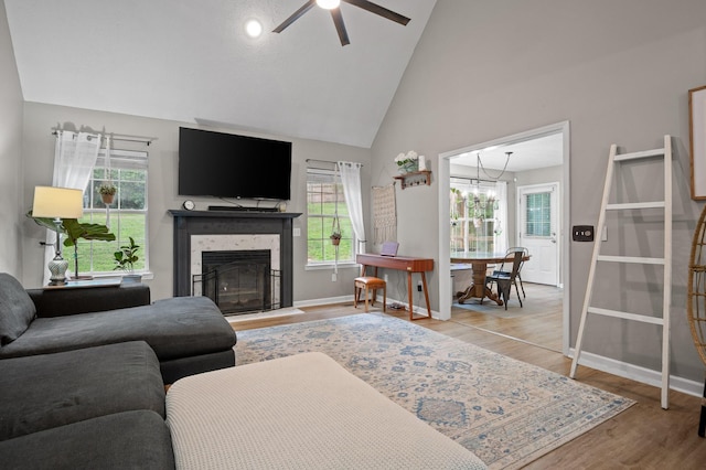 2321 Chimney Hills Dr, Soddy Daisy, TN 37379 - living area featuring plenty of natural light, a ceiling fan, wood finished floors, baseboards, and high vaulted ceiling