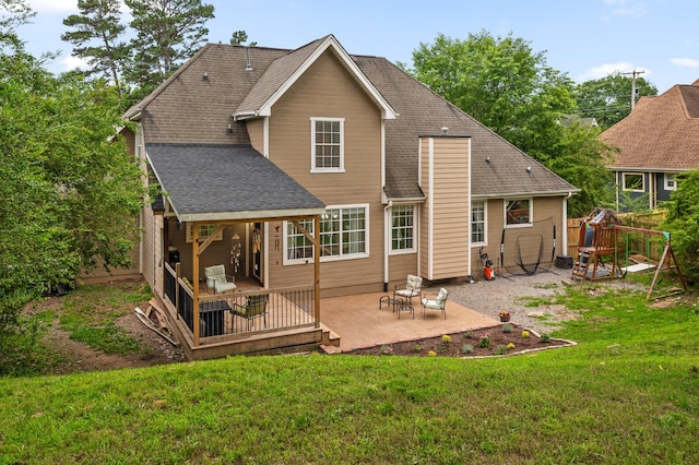 2321 Chimney Hills Dr, Soddy Daisy, TN 37379 - back of property featuring a patio area, a playground, a lawn, and a shingled roof