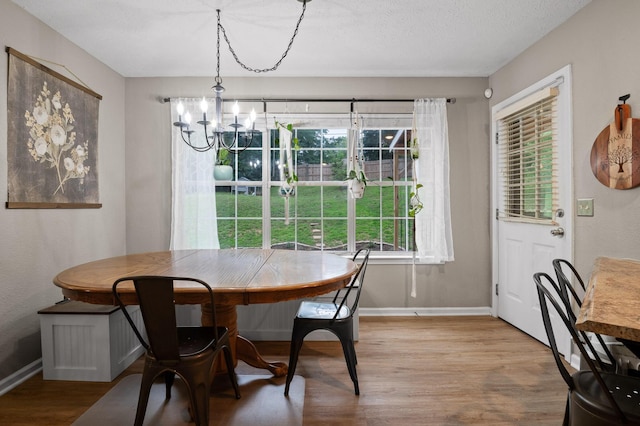 2321 Chimney Hills Dr, Soddy Daisy, TN 37379 - dining space with wood finished floors, a chandelier, and baseboards