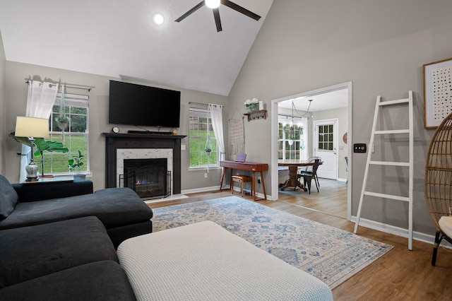 2321 Chimney Hills Dr, Soddy Daisy, TN 37379 - living room featuring wood finished floors, a ceiling fan, plenty of natural light, high vaulted ceiling, and baseboards