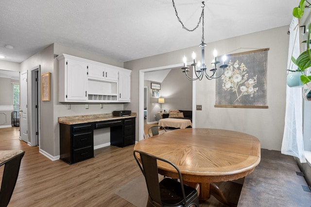2321 Chimney Hills Dr, Soddy Daisy, TN 37379 - dining room with a chandelier, wood finished floors, and baseboards