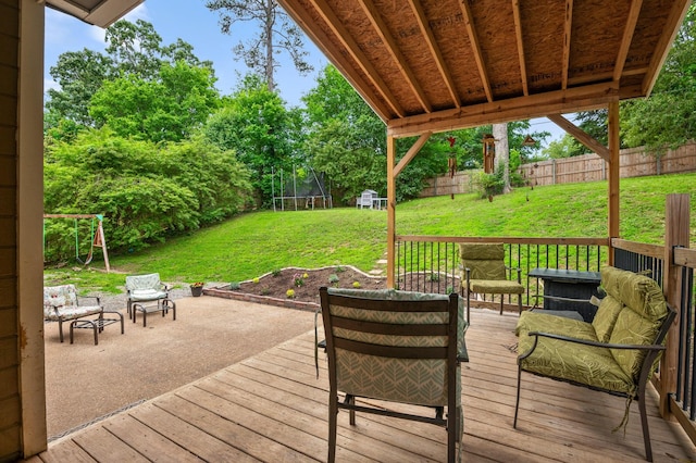 2321 Chimney Hills Dr, Soddy Daisy, TN 37379 - wooden deck with a trampoline and a patio