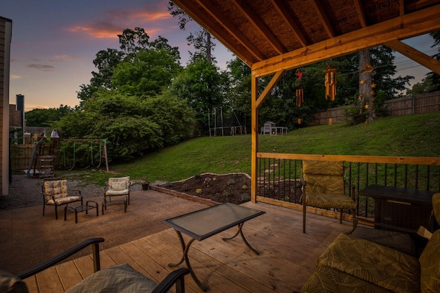 2321 Chimney Hills Dr, Soddy Daisy, TN 37379 - patio terrace at dusk featuring a wooden deck and a playground