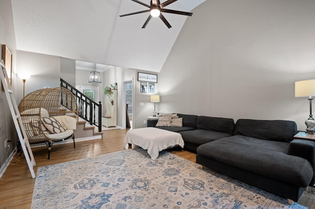 2321 Chimney Hills Dr, Soddy Daisy, TN 37379 - living room featuring high vaulted ceiling, stairway, a ceiling fan, wood finished floors, and baseboards