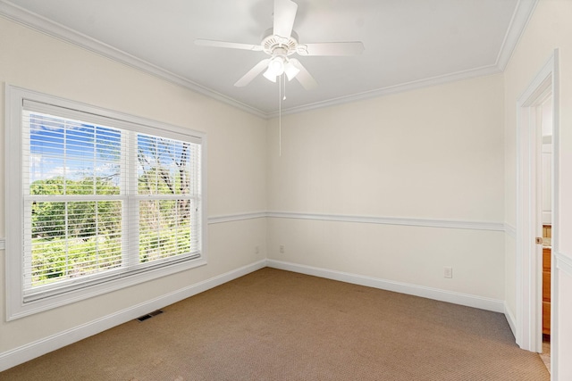 203 Tom Robinson Rd, Franklin, TN 37064 - spare room featuring visible vents, baseboards, ceiling fan, crown molding, and light colored carpet