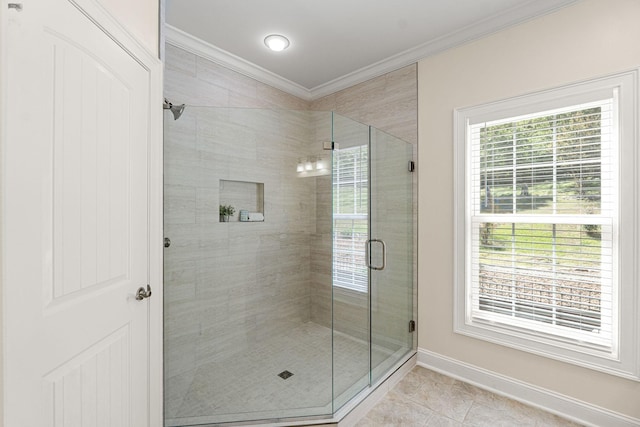 203 Tom Robinson Rd, Franklin, TN 37064 - bathroom featuring a shower stall, tile patterned floors, baseboards, and crown molding