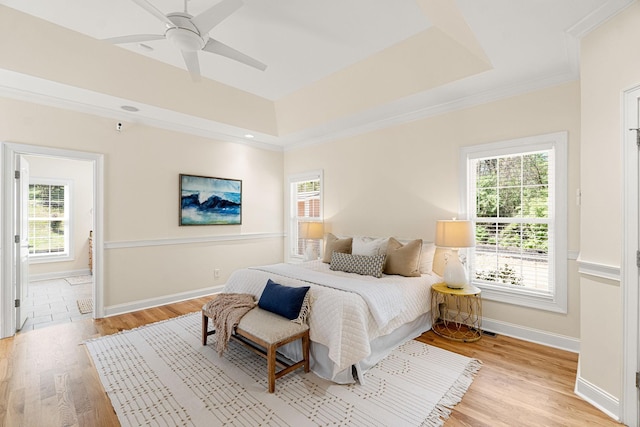 203 Tom Robinson Rd, Franklin, TN 37064 - bedroom with light wood finished floors, baseboards, crown molding, and a ceiling fan