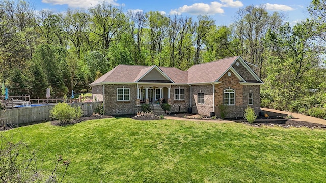 203 Tom Robinson Rd, Franklin, TN 37064 - view of front of home with a fenced in pool, a front lawn, and brick siding