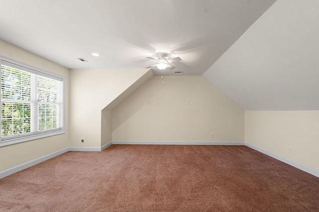 203 Tom Robinson Rd, Franklin, TN 37064 - additional living space with ceiling fan, visible vents, light carpet, lofted ceiling, and baseboards