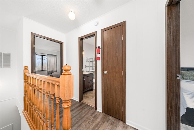 13 Wilshire Heights Dr, Crossville, TN 38558 - hall with wood finished floors, visible vents, and an upstairs landing