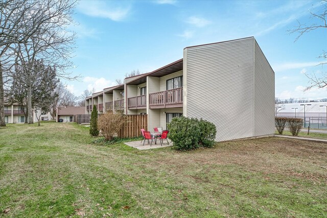 13 Wilshire Heights Dr, Crossville, TN 38558 - back of house featuring a patio and a lawn