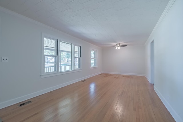115 Highland Dr, Winchester, TN 37398 - empty room with light wood-style floors, ceiling fan, baseboards, ornamental molding, and visible vents