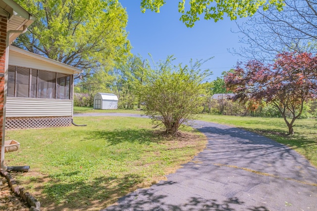 115 Highland Dr, Winchester, TN 37398 - view of yard with a sunroom, an outbuilding, and a shed