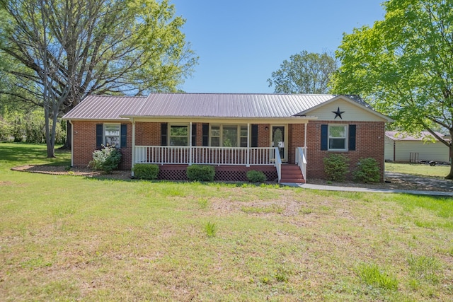 115 Highland Dr, Winchester, TN 37398 - ranch-style home with a porch, a front lawn, brick siding, and metal roof