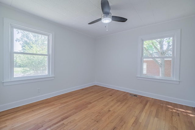 115 Highland Dr, Winchester, TN 37398 - spare room with visible vents, light wood-style flooring, baseboards, and crown molding