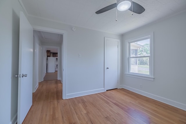 115 Highland Dr, Winchester, TN 37398 - unfurnished bedroom featuring freestanding refrigerator, attic access, light wood-style flooring, and baseboards