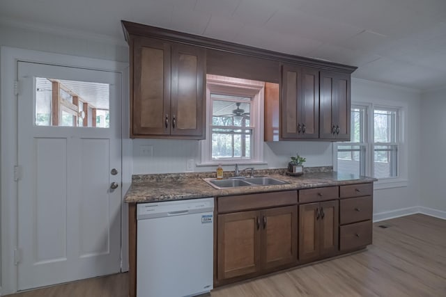 115 Highland Dr, Winchester, TN 37398 - kitchen featuring a sink, light wood-type flooring, dark countertops, white dishwasher, and crown molding
